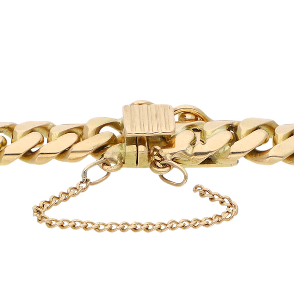 Pulsera eslabón barbado con una moneda de veinte pesos y dos monedas de cinco pesos oro mexicano 21.6 kilates en oro amarillo 18 kilates.