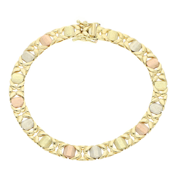 Pulsera eslabón articulado en oro tres tonos 14 kilates.