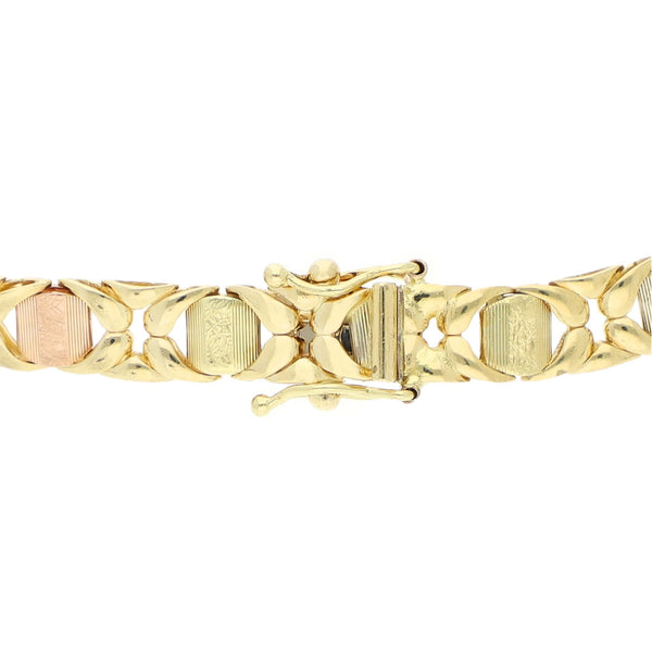 Pulsera eslabón articulado en oro tres tonos 14 kilates.