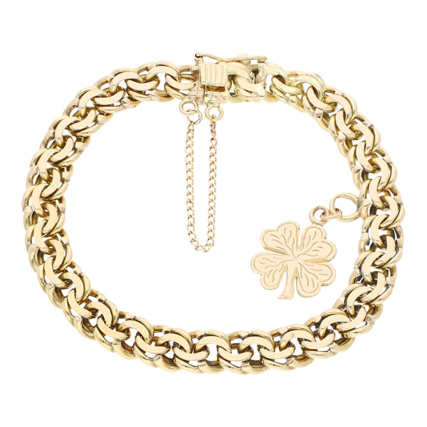 Pulsera eslabón encontrado doble con colgante motivo trébol en oro amarillo 14 kilates