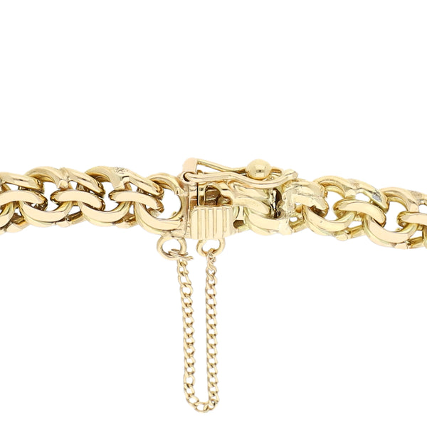 Pulsera eslabón encontrado doble con colgante motivo trébol en oro amarillo 14 kilates