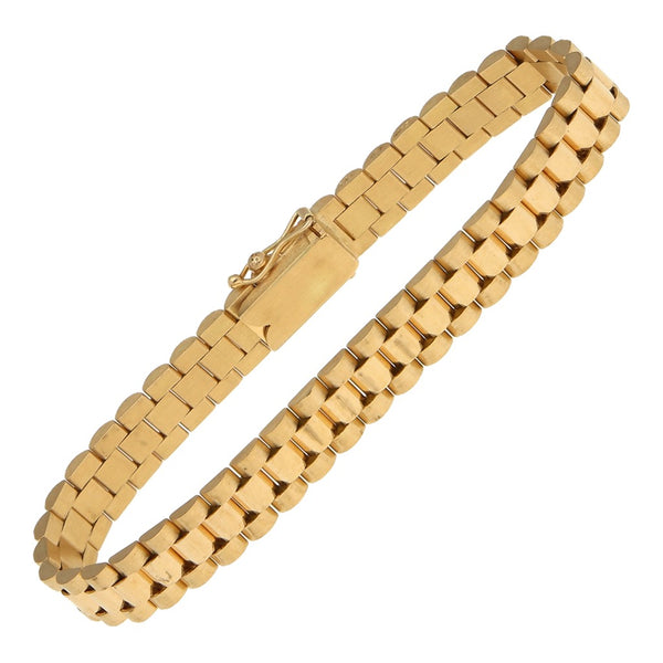 Pulsera eslabón articulado con aplicación motivo corona en oro amarillo 14 kilates