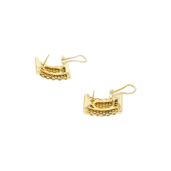 Aretes diseño especial en oro amarillo 14 kilates.