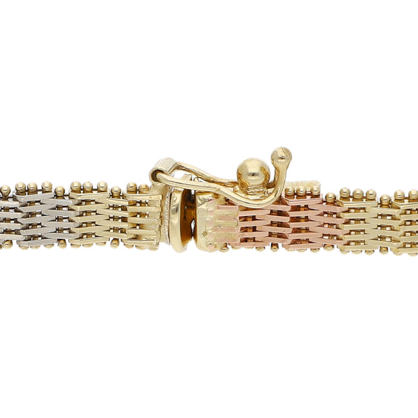 Pulsera eslabón boleado en oro tres tonos 14 kilates.