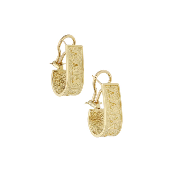 Aretes diseño especial en oro amarillo 14 kilates.