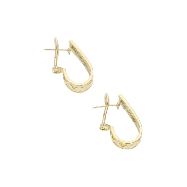 Aretes diseño especial en oro amarillo 14 kilates.