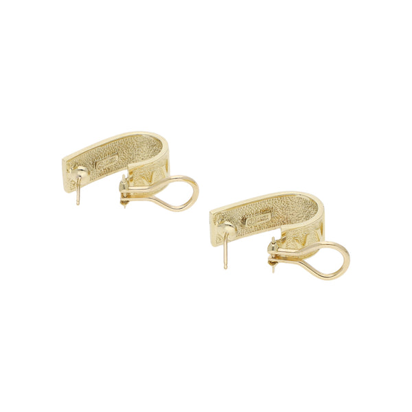 Aretes diseño especial en oro amarillo 14 kilates.
