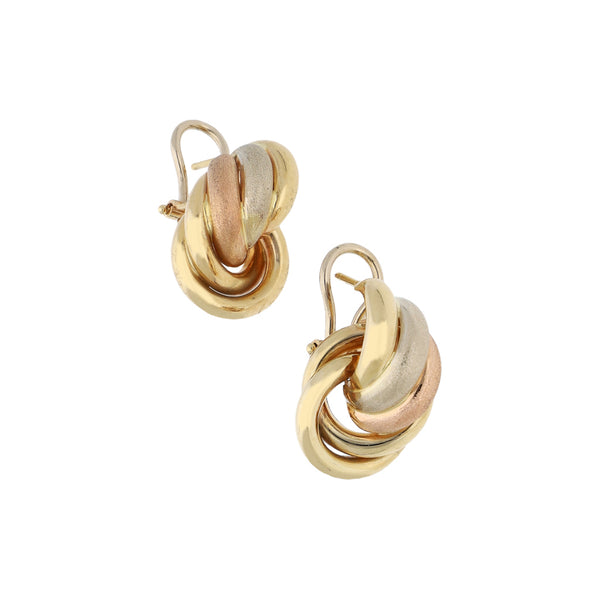 Aretes estilizados en oro tres tonos 14 kilates.