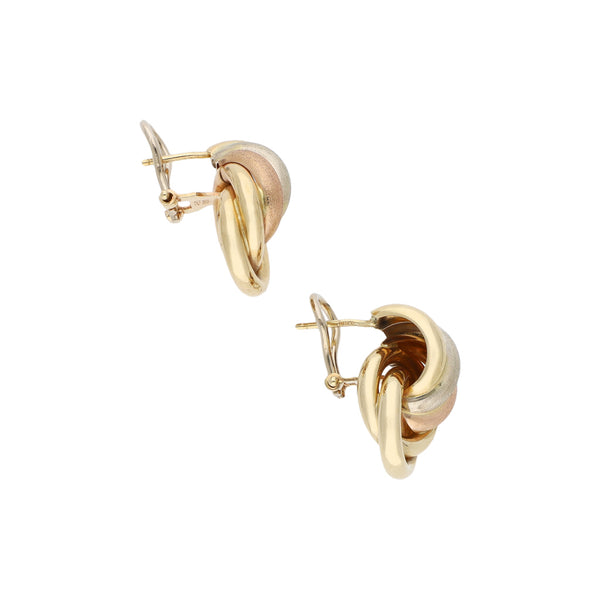 Aretes estilizados en oro tres tonos 14 kilates.