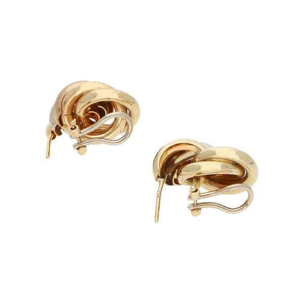 Aretes estilizados en oro tres tonos 14 kilates.