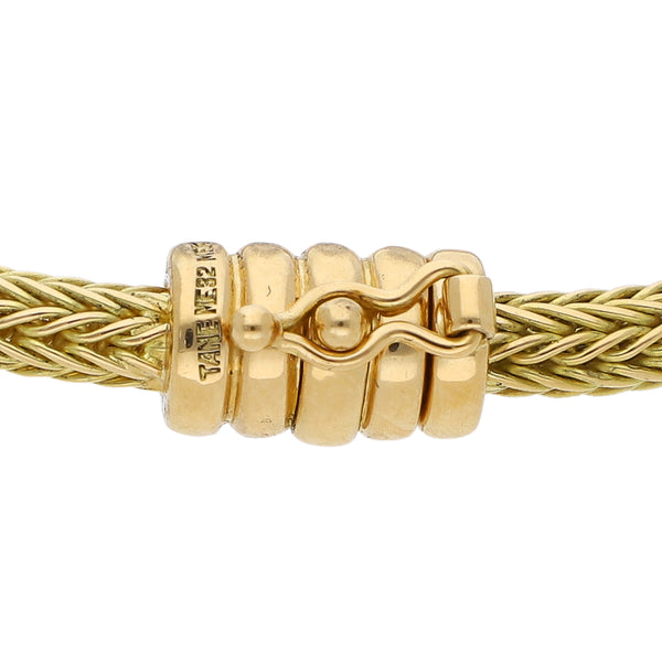 Pulsera eslabón tejido firma Tane en oro amarillo 18 kilates.