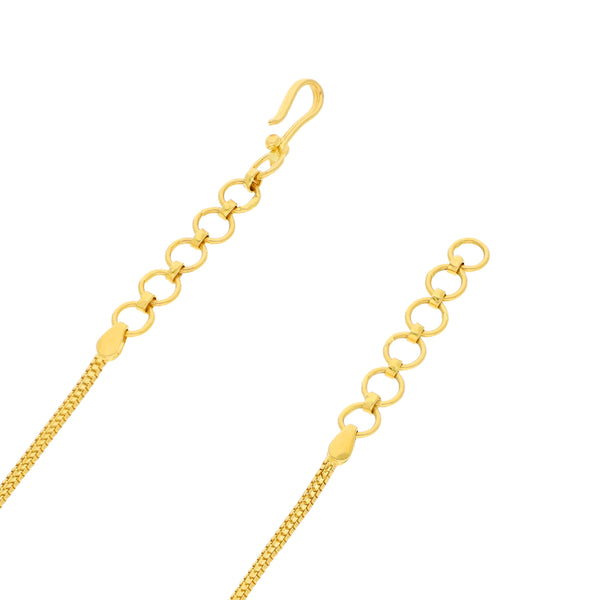 Gargantilla eslabón combinado con aplicaciones y colgante motivo flor con circonias en oro amarillo 22 kilates.