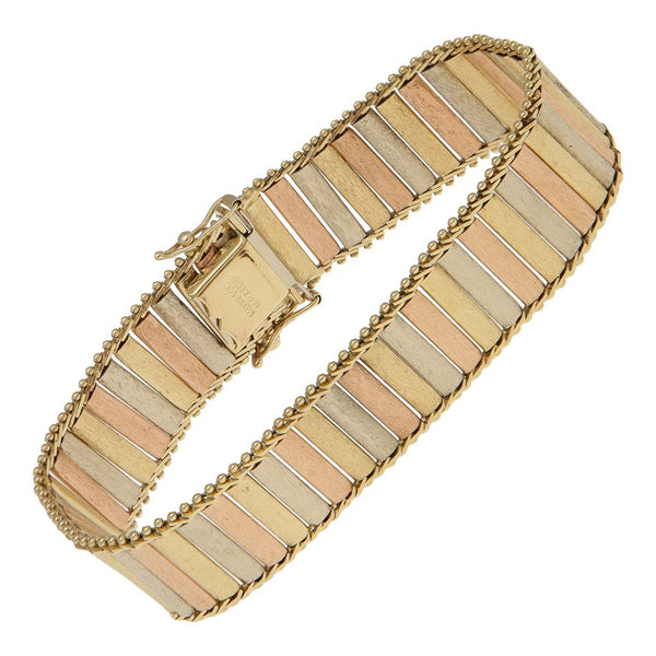 Pulsera eslabón articulado en oro tres tonos 14 kilates.