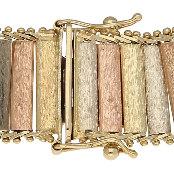Pulsera eslabón articulado en oro tres tonos 14 kilates.
