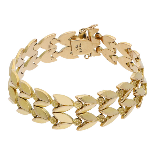 Pulsera eslabón articulado motivo flores en oro amarillo 18 kilates.