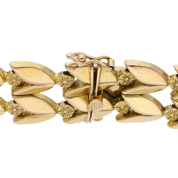 Pulsera eslabón articulado motivo flores en oro amarillo 18 kilates.