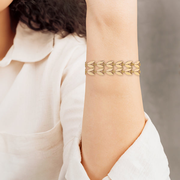 Pulsera eslabón articulado motivo flores en oro amarillo 18 kilates.