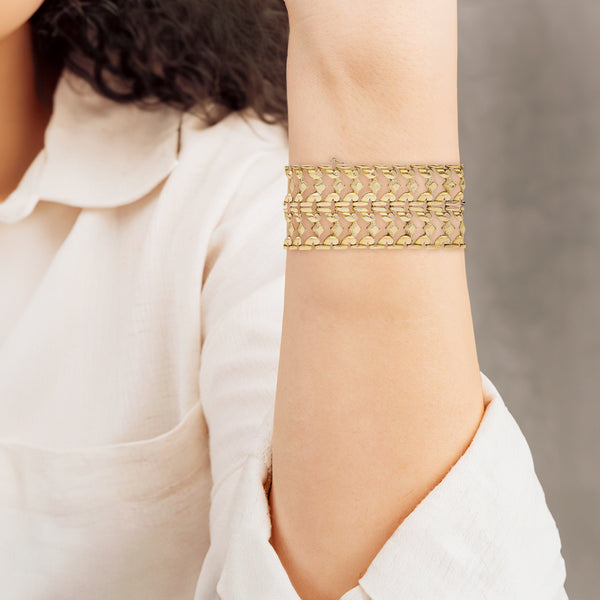 Pulsera de dos hilos eslabón articulado en oro amarillo 18 kilates.