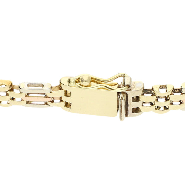 Pulsera eslabón articulado en oro tres tonos 14 kilates.