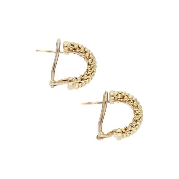 Aretes boleados en oro amarillo 14 kilates.
