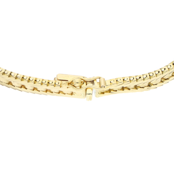 Pulsera eslabón laminado con sinteticos en oro amarillo 18 kilates.