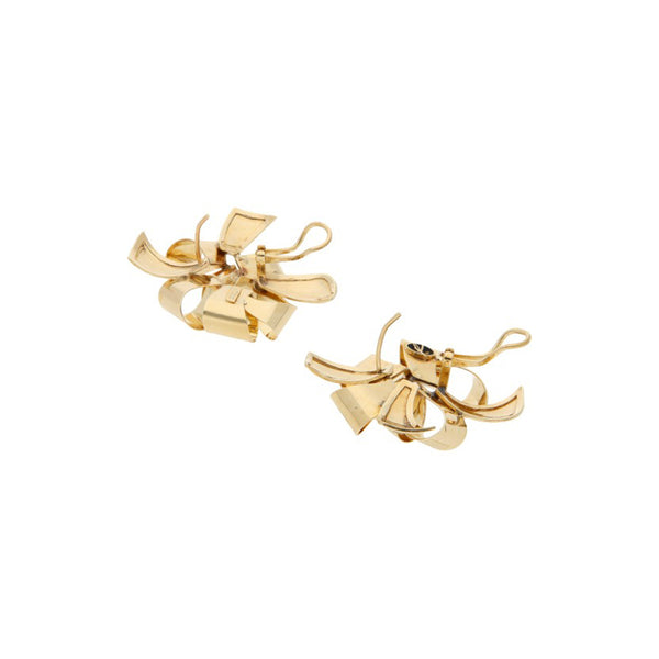 Aretes diseño especial motivo moño en oro amarillo 14 kilates.