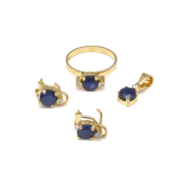 Juego de anillo, dije y aretes diseño especial con zafiros y diamantes en oro amarillo 14 kilates.