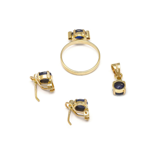 Juego de anillo, dije y aretes diseño especial con zafiros y diamantes en oro amarillo 14 kilates.