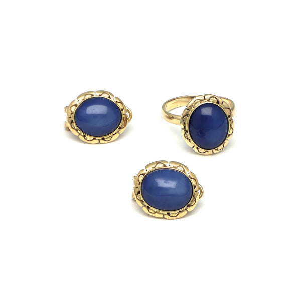 Juego de anillo y aretes calados con zafiro estrella en oro amarillo 14 kilates.
