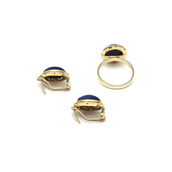 Juego de anillo y aretes calados con zafiro estrella en oro amarillo 14 kilates.