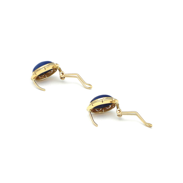 Juego de anillo y aretes calados con zafiro estrella en oro amarillo 14 kilates.