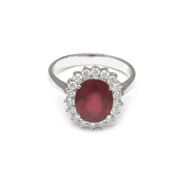 Anillo diseño especial con diamantes y rubí en oro blanco 14 kilates.