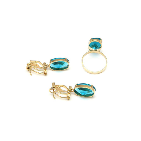 Juego de anillo y aretes diseño especial con obsidiana azul y diamantes en oro amarillo 14 kilates.