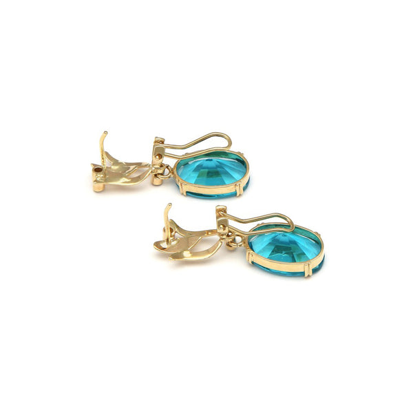 Juego de anillo y aretes diseño especial con obsidiana azul y diamantes en oro amarillo 14 kilates.