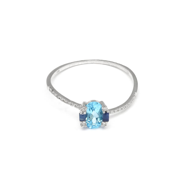 Anillo diseño especial con diamantes y Topacio Suizo en oro blanco 14 kilates.