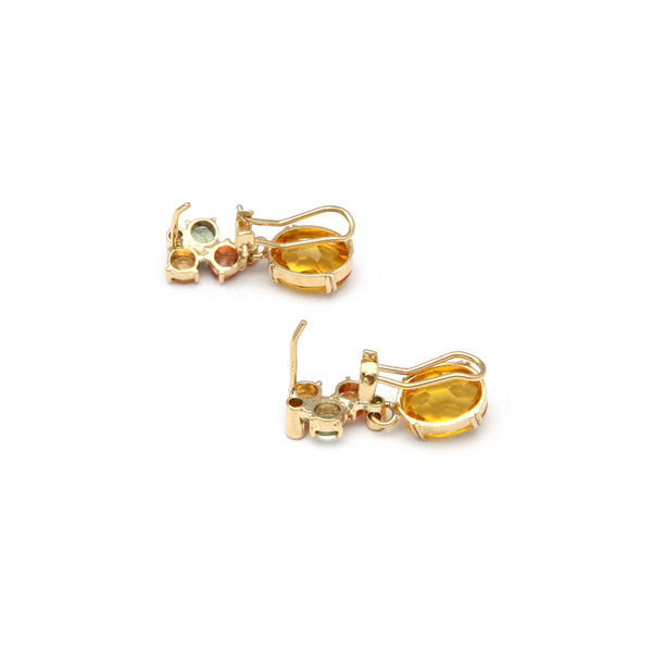 Juego de aretes y anillo diseño especial con citrino y circonias en oro amarillo 14 kilates.