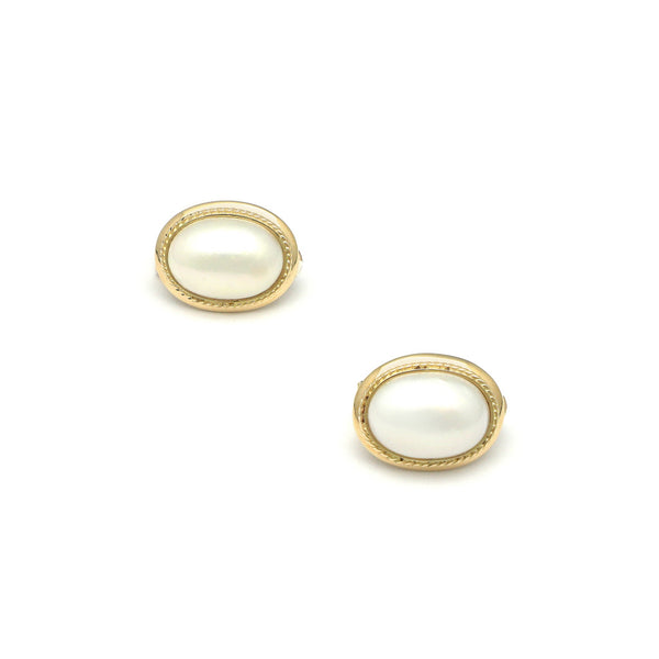 Aretes torzal con media perla en oro amarillo 14 kilates.