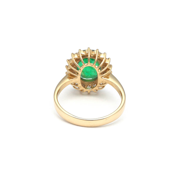 Anillo diseño especial con diamantes y esmeralda en oro amarillo 14 kilates.