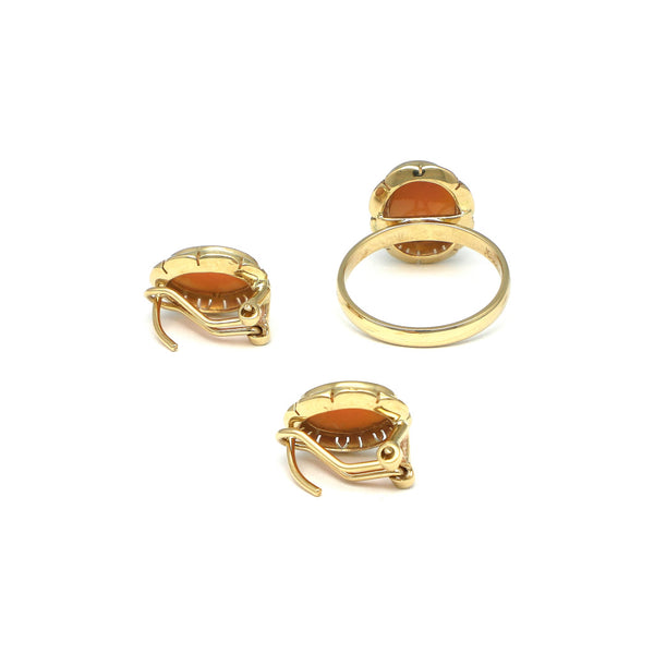Juego de anillo y aretes diseño especial motivo dama en oro amarillo 14 kilates.