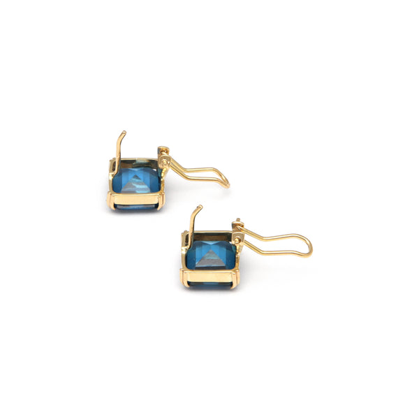 Juego de anillo y aretes diseño especial con blue London en oro amarillo 14 kilates.
