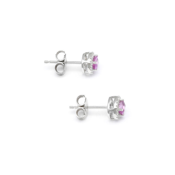 Aretes diseño especial con diamantes y zafiros rosas en oro blanco 14 kilates.