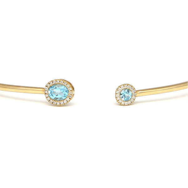 Pulsera de arillo abierta en con diamantes y aguamarina en oro amarillo 14 kilates.