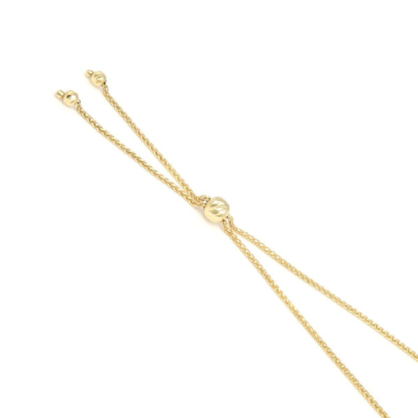 Pulsera eslabón tejido con aplicación de diamantes en oro amarillo 14 kilates.