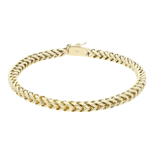 Pulsera eslabón tejido en oro amarillo 14 kilates.