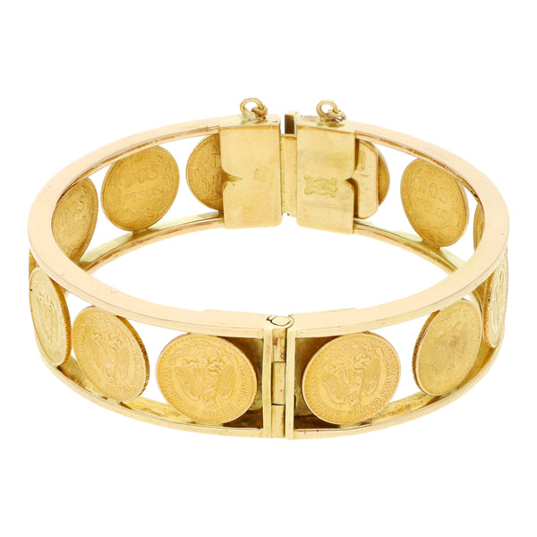 Pulsera de arillo articulada con trece monedas de dos pesos oro mexicano 21.6 kilates en oro amarillo 18 kilates.