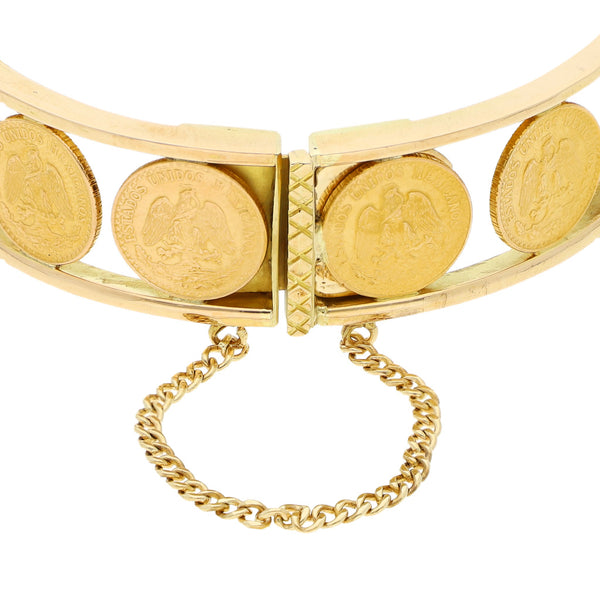Pulsera de arillo articulada con trece monedas de dos pesos oro mexicano 21.6 kilates en oro amarillo 18 kilates.