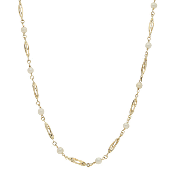 Collar eslabón articulado con aplicaciones de perlas en oro amarillo 14 kilates.
