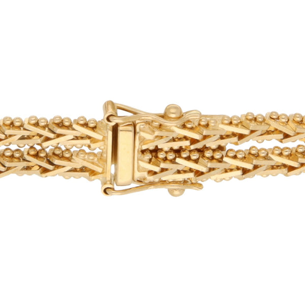 Pulsera dos hilos eslabón boleado en oro amarillo 18 kilates.