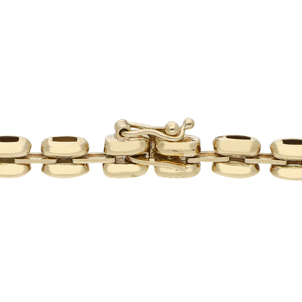 Pulsera eslabón articulado con aplicación y sintéticos en oro amarillo 14 kilates.