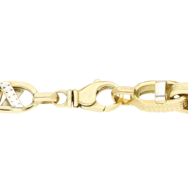 Pulsera eslabón cruzado en oro dos tonos 14 kilates.
